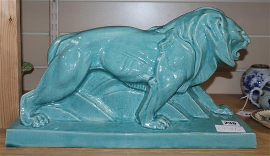 A turquoise glazed Art Deco pottery model of a lion width 44cm